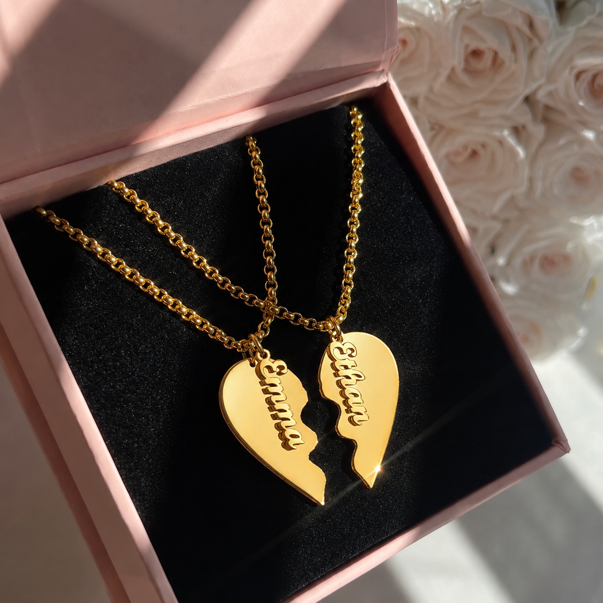 Gold heart-shaped pendant necklace with 'mommy' and 'daddy' inscriptions in a pink box.