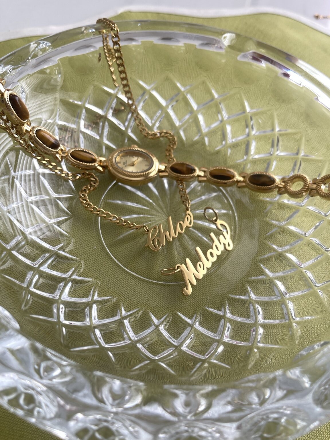 Gold personalized jewelry styled with vintage crystal